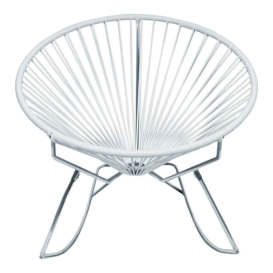 White Acapulco chair with a round shape and delicate wire pattern, featuring a sleek chrome base.