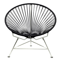 Black wire chair with a circular, radiating pattern on a sleek silver frame. Modern design for stylish interiors.