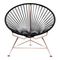 Black Acapulco chair with a sleek, modern design and rose gold metal frame. Perfect geometric lines and patterns.