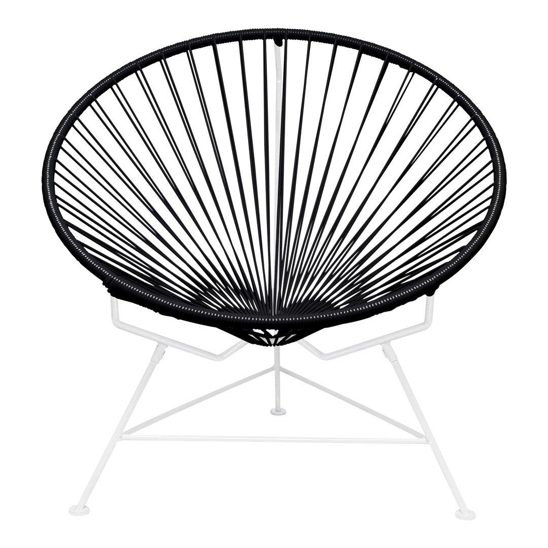 Black Acapulco chair with a radiating linear design, featuring a sleek white metal base. Perfect for modern decor.