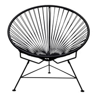 Black Acapulco chair featuring a sleek, radial pattern and minimalist metal frame. Ideal for modern decor.
