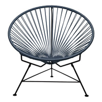 Acapulco chair in deep navy blue with a striking radial pattern and sleek black metal frame. Perfect for modern decor.
