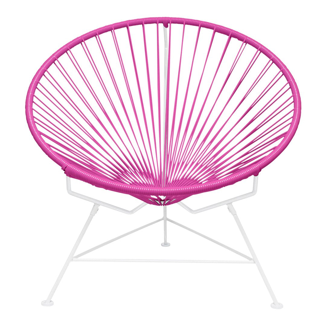 Vibrant pink Acapulco chair with a striking radial pattern and sleek white base, perfect for modern decor.
