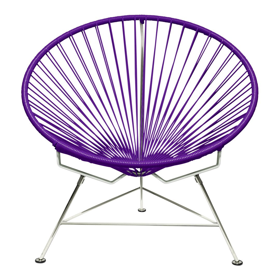 Vibrant purple Acapulco chair with a unique radial design and sleek chrome base, perfect for modern decor.