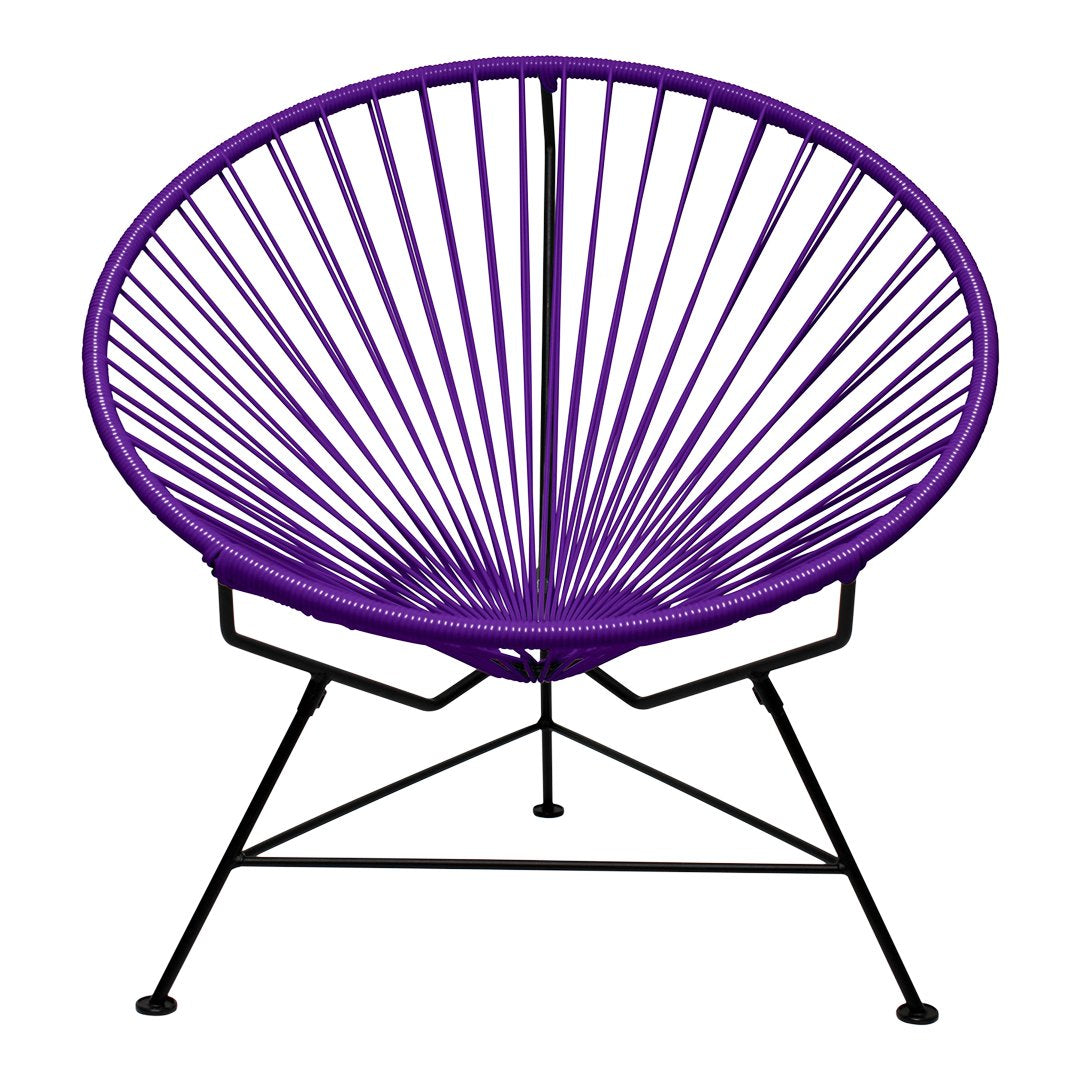 Purple Acapulco chair with a spindle pattern and black metal frame, showcasing modern, vibrant design elements.