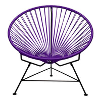 Purple Acapulco chair with a spindle pattern and black metal frame, showcasing modern, vibrant design elements.