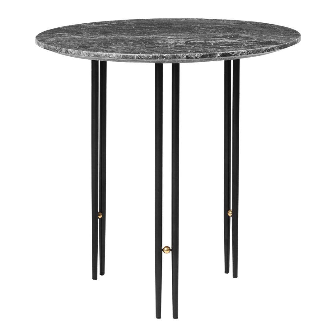 Round black marble top table with sleek black legs and golden accents. Modern design for stylish interiors.