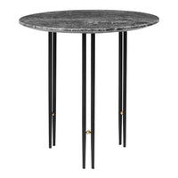 Round black marble top table with sleek black legs and golden accents. Modern design for stylish interiors.