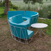 Turquoise outdoor seating set with white metal frame and circular table, featuring modern geometric design.