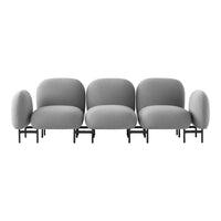 Gray modular sofa featuring smooth, rounded cushions and minimalist black legs for a modern aesthetic.