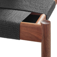Black woven fabric with a textured finish and rich wooden accents in a warm brown tone. Elegant modern design.