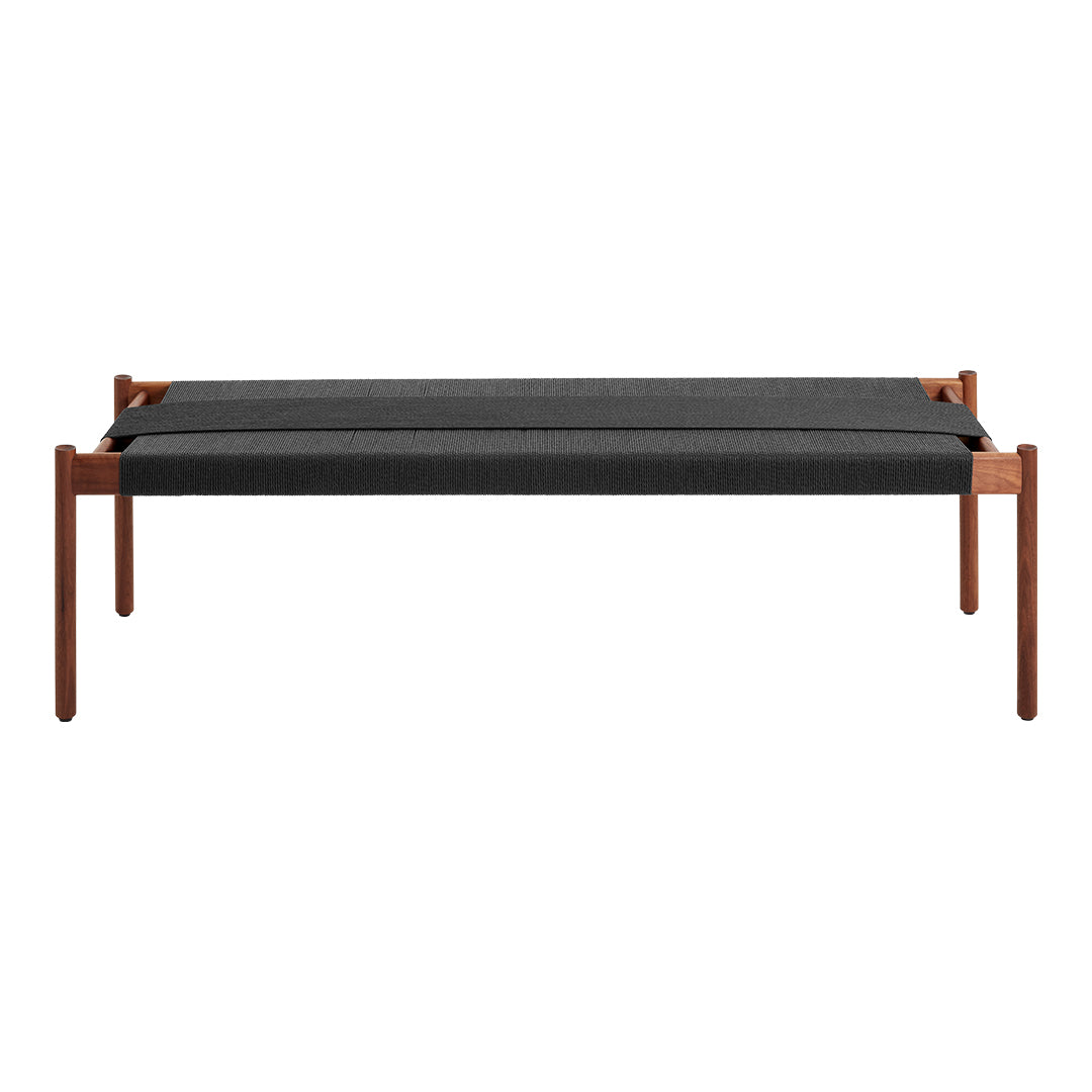"Modern bench with a sleek black woven cushion and warm wooden frame, featuring clean lines and minimalist design."