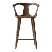 Wooden bar stool with a warm walnut finish, showcasing a smooth, natural grain pattern for a rustic touch.