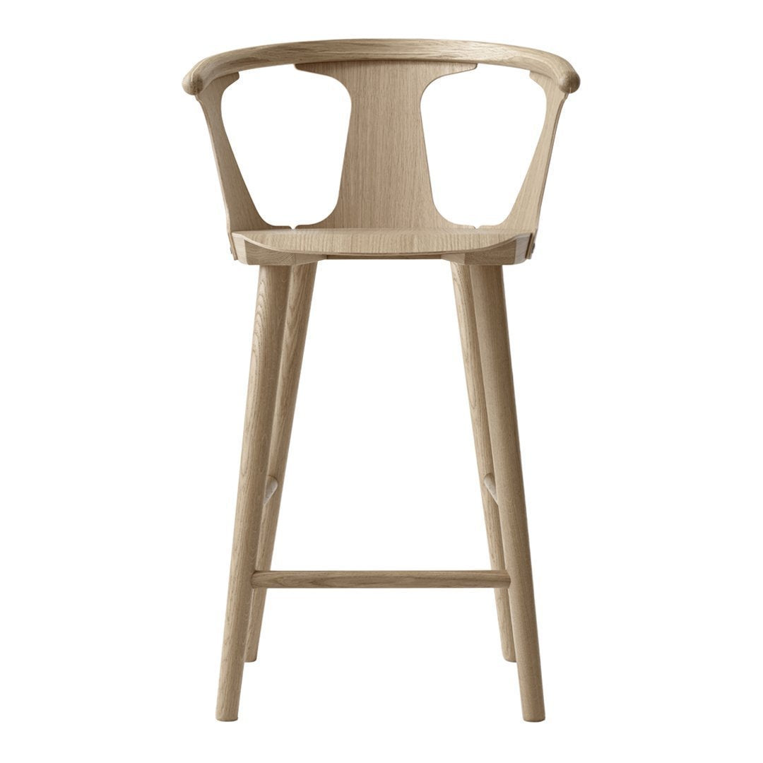 Natural wood bar stool with a light beige finish and a sleek, minimalist design. Ideal for modern interiors.