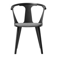 Black modern chair with a sleek design and gray upholstered cushion for stylish seating.