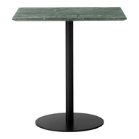 Green marble top with veining on a sleek black metal base and round pedestal. Modern minimalist design.