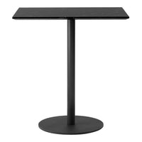 Black metal table with a sleek rectangular top and circular base, showcasing a minimalistic design.