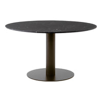 Round black marble table with a sleek, matte black base, featuring subtle veining and a modern minimalist design.
