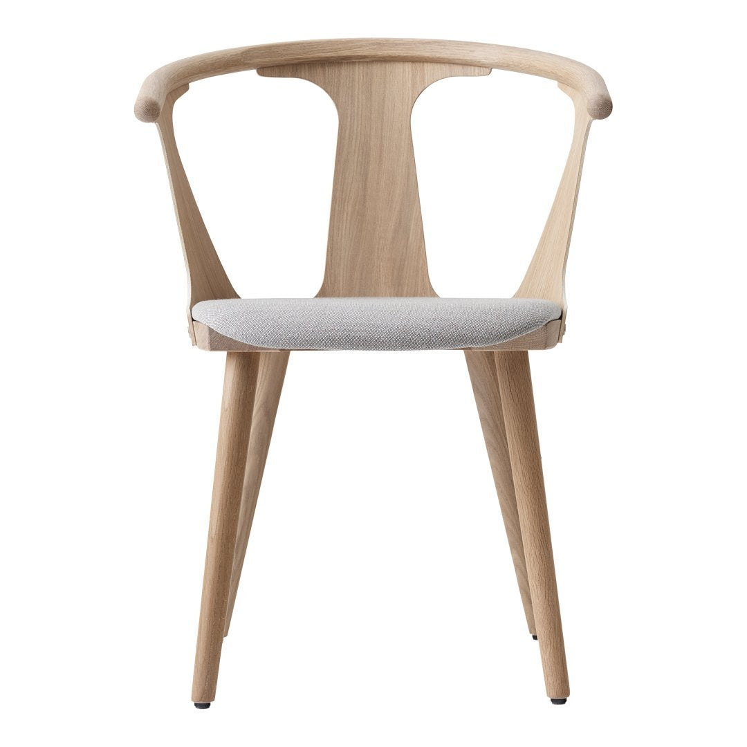Light natural wood chair with a soft gray seat and sleek, modern design. Perfect for contemporary interiors.