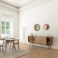 "Modern wooden sideboard with geometric brown and natural wood patterns, complemented by a neutral-toned room setting."