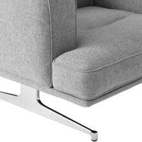 Gray upholstered armchair with a smooth, subtle texture and sleek chrome base. Perfect for modern interiors.