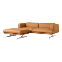 Tan leather sectional sofa with sleek modern lines and chrome legs, perfect for contemporary interiors.