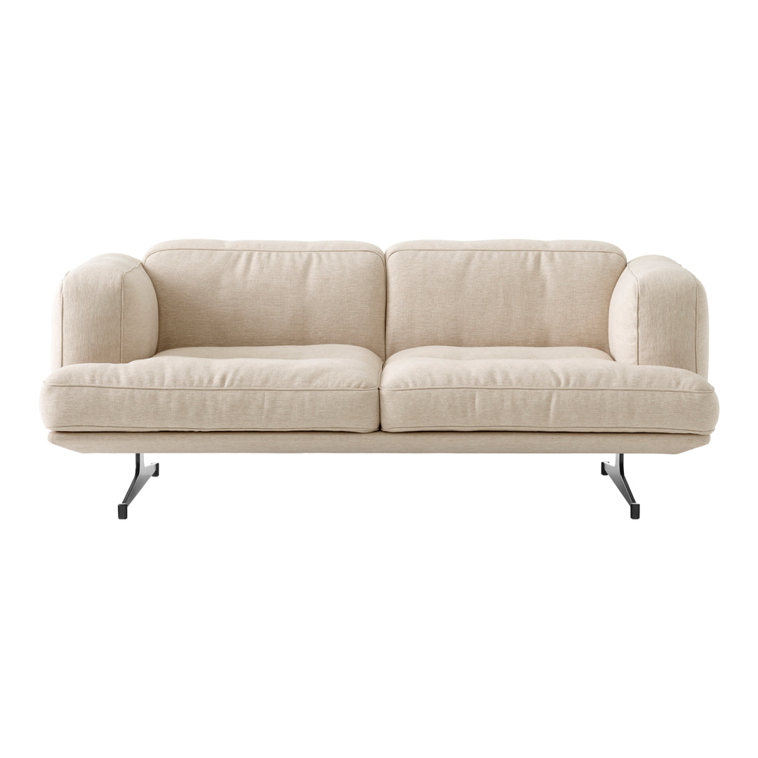 Beige sofa with a minimalist design, featuring soft, textured upholstery and sleek black metal legs.