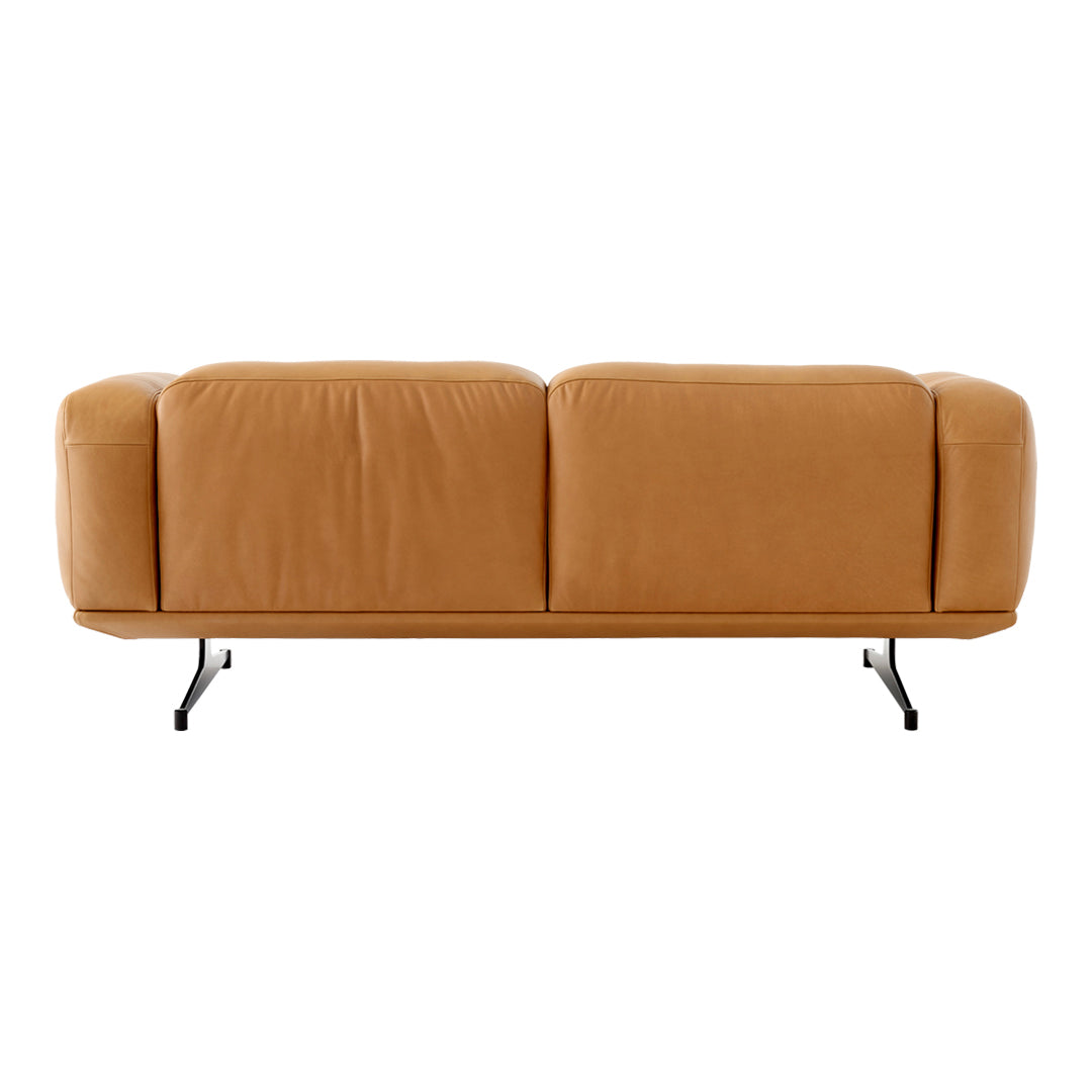 Tan leather sofa with a smooth texture and minimalist design, featuring black metal legs for a modern touch.