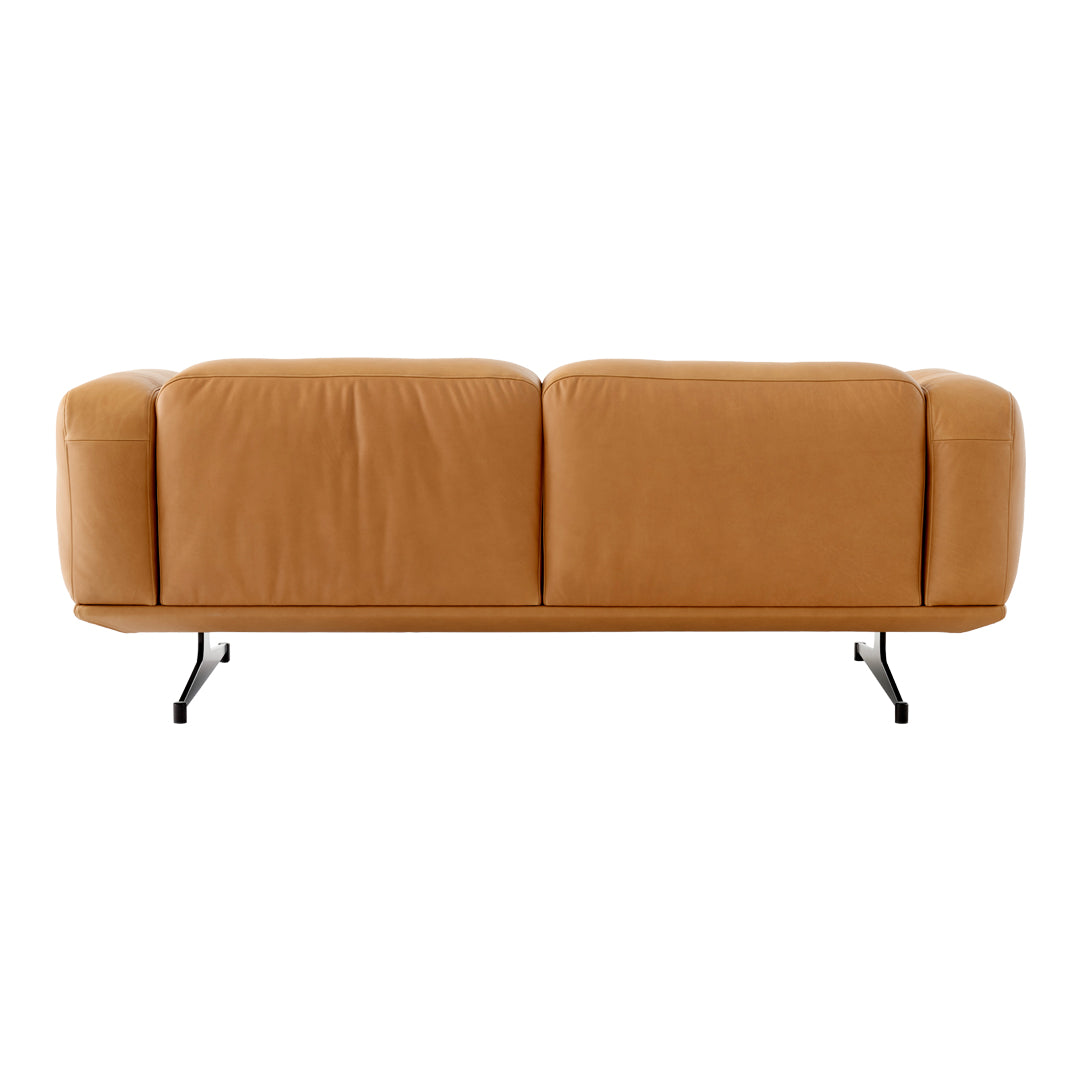 Tan leather couch with sleek lines and minimalistic black metal legs, perfect for modern decor.