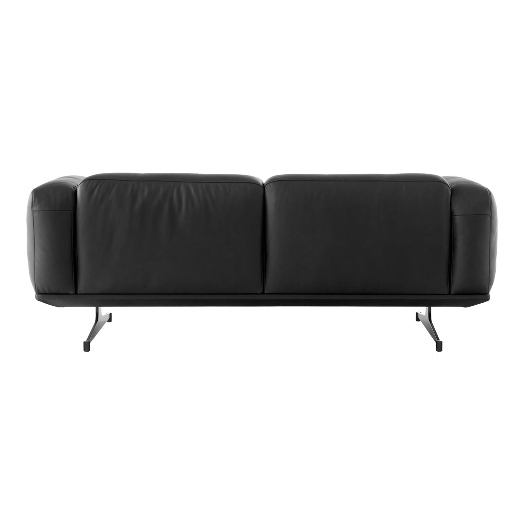 Elegant black leather sofa with smooth, minimalist design and sleek metal legs, perfect for contemporary decor.