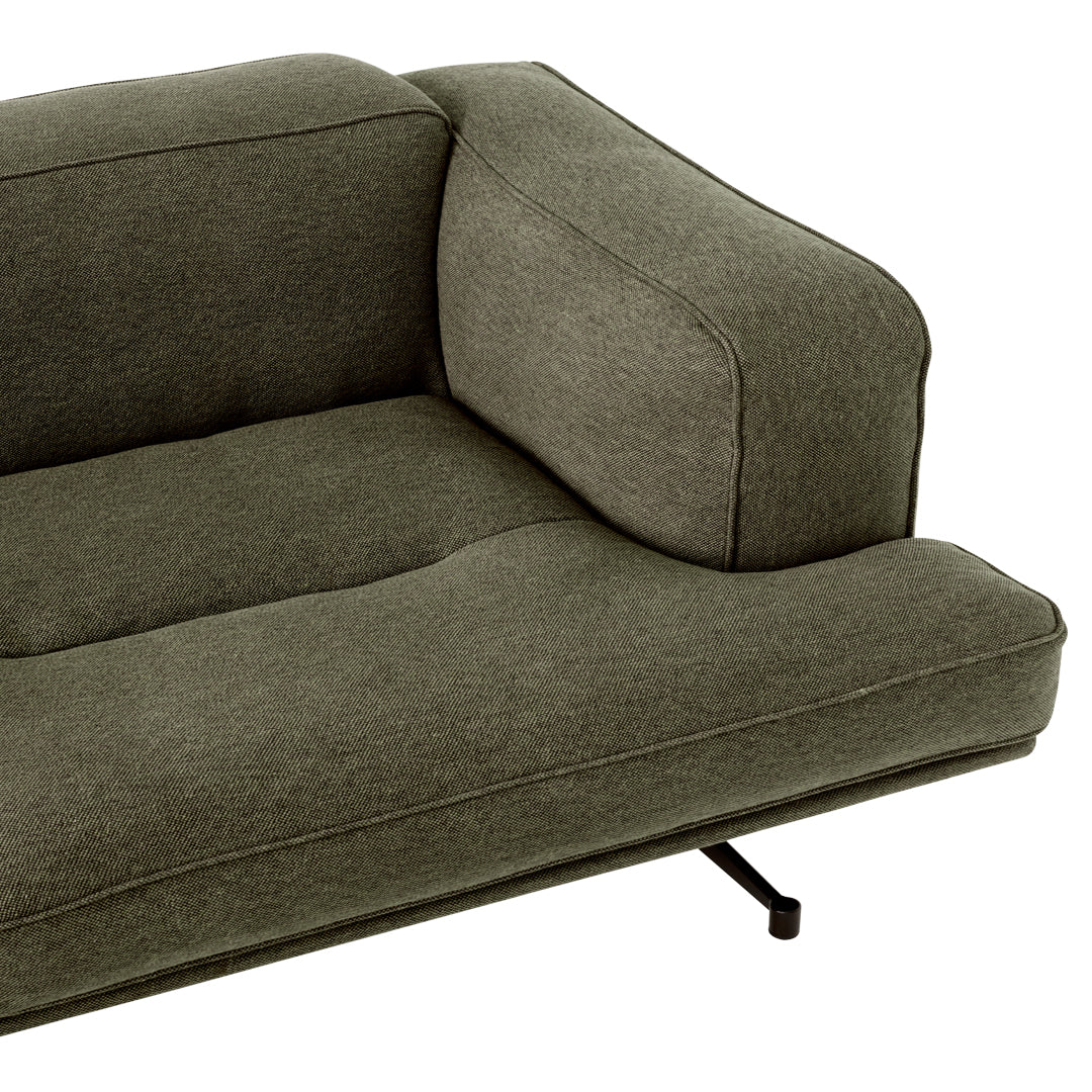 Olive green modern sofa with clean lines and minimalist design, featuring a soft, textured fabric and sleek black legs.