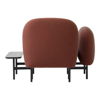 "Brown rounded chair with smooth upholstery and minimalist black metal frame."