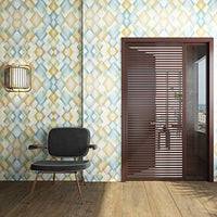 Geometric patterned wallpaper in soft blue, yellow, and white tones, creating a modern aesthetic.