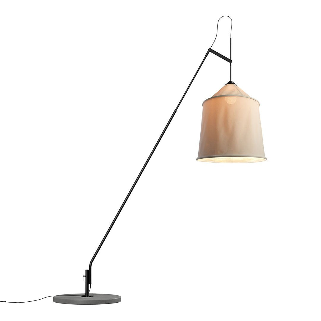 Modern black floor lamp with a warm beige fabric shade and sleek metallic base. Perfect for stylish interiors.