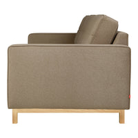 Side view of a taupe couch with a smooth fabric finish and light wood legs for a minimalist look.
