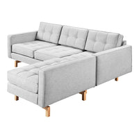 Gray tufted fabric sectional sofa with a modern design and wooden legs, perfect for contemporary living spaces.