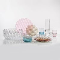 Colorful glassware collection featuring pink, blue, and transparent textures with geometric patterns. Perfect for stylish dining.