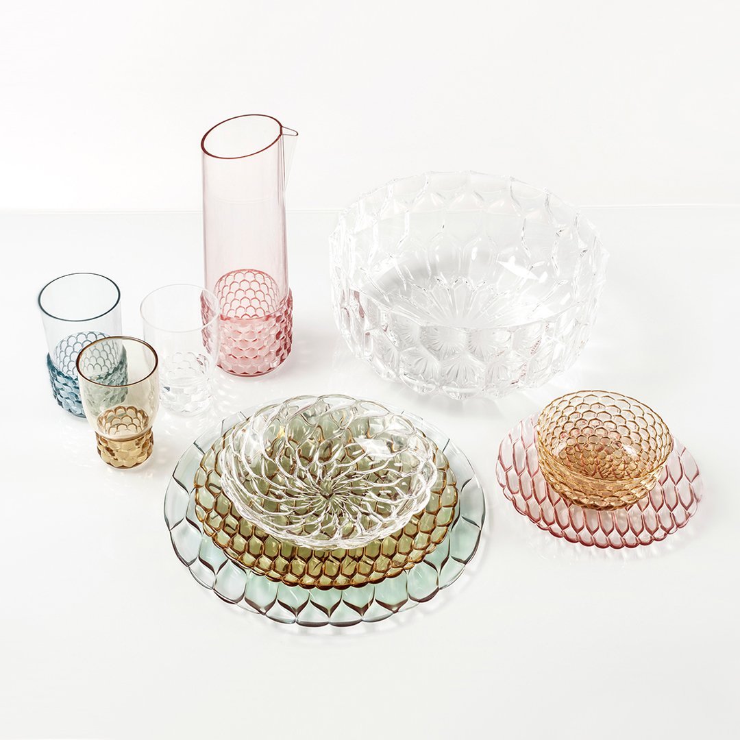 Colorful glassware set featuring pink, green, gold, and clear patterns with elegant textures and intricate designs.