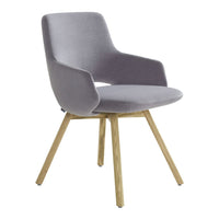 Stylish gray velvet chair with smooth curves and natural wooden legs, perfect for modern decor.