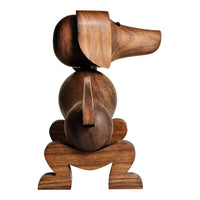 Wooden dog sculpture in rich brown tones, featuring smooth curves and a minimalist design. Perfect for decor.