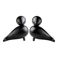 Black ceramic bird figurines featuring smooth, glossy surfaces and rounded shapes, perfect for modern decor.
