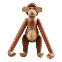Wooden monkey figure in rich brown tones with natural wood grain patterns and smooth finishes. Ideal for decor.