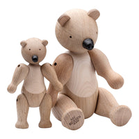 Wooden bear toys in natural wood finish, featuring smooth grain patterns and a minimalist design.