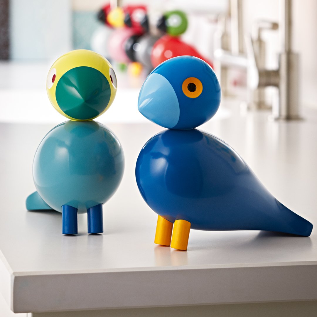 Colorful bird figurines in blue, yellow, and green, featuring bright accents and playful patterns. Ideal for decor.