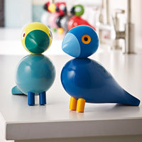 Colorful bird figurines in blue, yellow, and green, featuring bright accents and playful patterns. Ideal for decor.