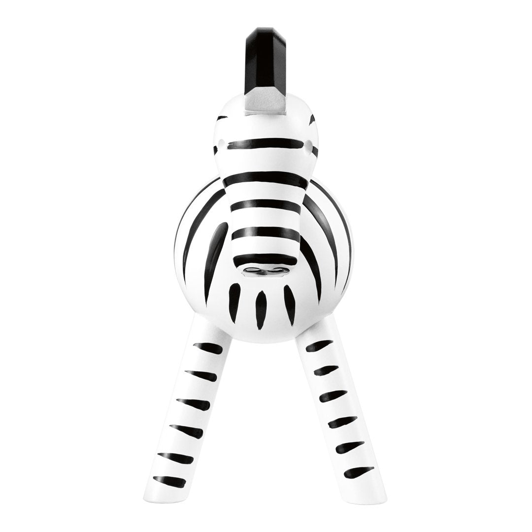 Black and white striped zebra toy with round body and sturdy legs, perfect for playful decor.