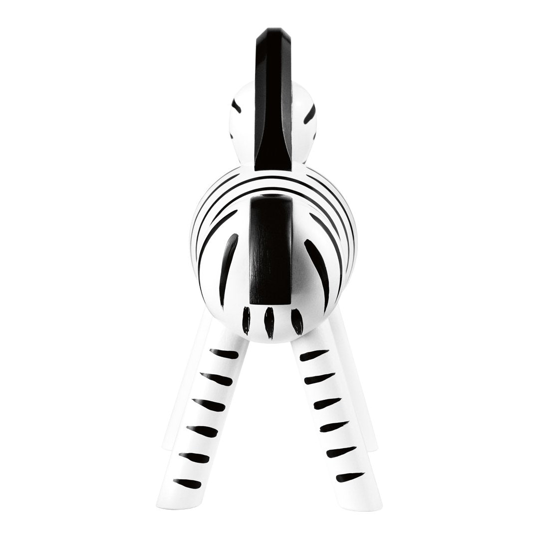 White zebra figurine with bold black stripes, showcasing a striking monochrome color pattern. Perfect for decor.