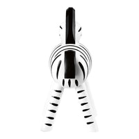 White zebra figurine with bold black stripes, showcasing a striking monochrome color pattern. Perfect for decor.