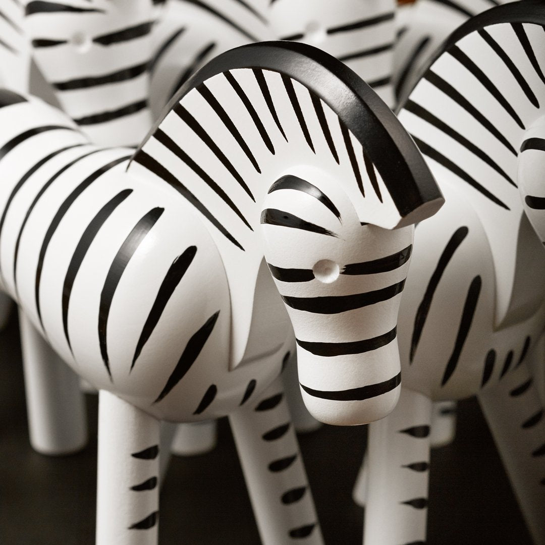 Black and white striped decorative zebras with glossy finish, perfect for home decor or gifting.