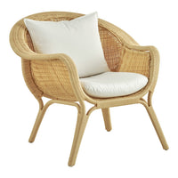 "Light beige wicker chair with a soft white cushion, featuring a curved, open weave design."